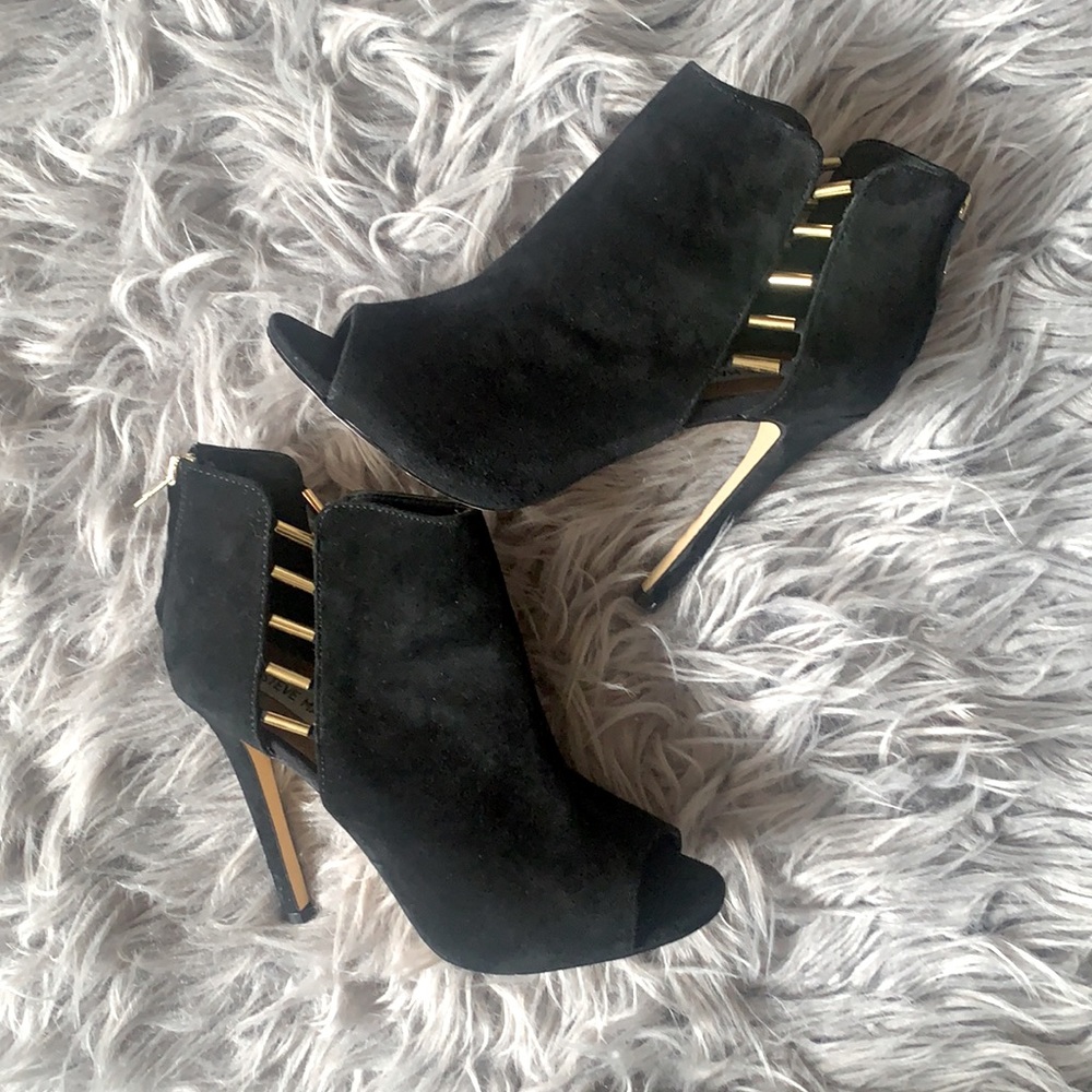 Black heeled booties with gold accent
